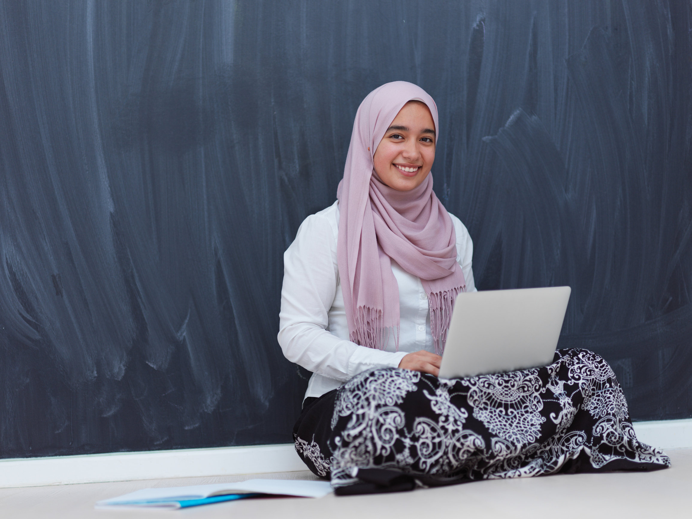 Arab Female Student Working on Laptop